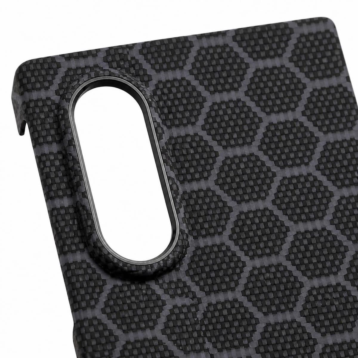 Camera detail: raised surround with a metal ring around the lenses, gray blue honeycomb pattern